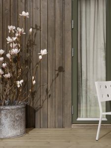 Detalj av beiset hus med fargen Trebitt Eldet Grå